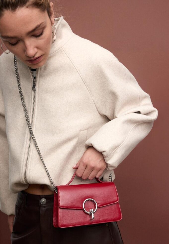 Borsa a tracolla con chiusura rotonda