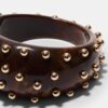 Bracciale rigido con borchie