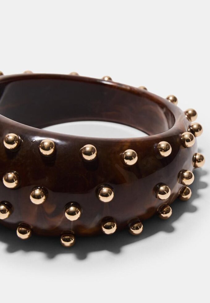 Bracciale rigido con borchie