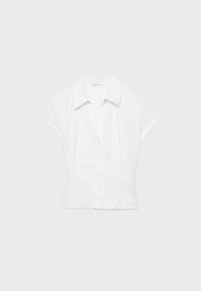 Camicia a maniche corte con cucitura sotto il seno Camicia a maniche corte con cucitura sotto il seno