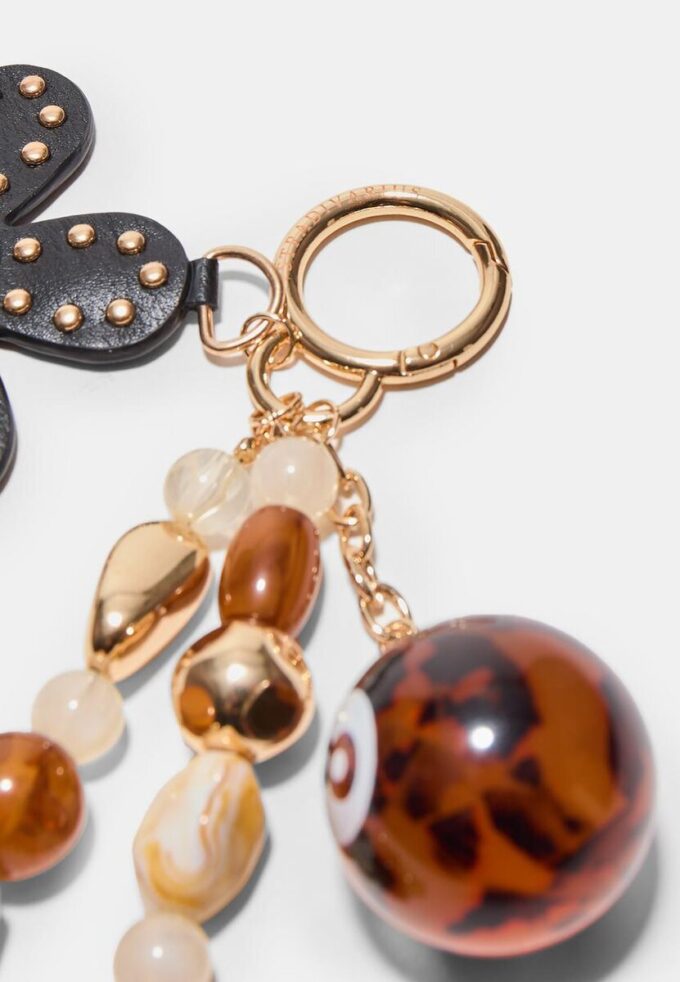 Ciondolo con fiore e pallina da biliardo