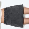 D62 Skort in denim con borchie