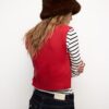 Gilet in maglia con spalline imbottite Gilet in maglia con spalline imbottite