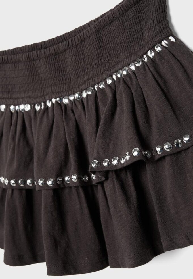 Minigonna con volant e borchie