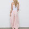 Pantaloni sarouel con pinces e fibbia