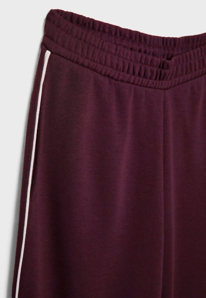 Pantaloni Wide Leg in tessuto felpato con bordino Pantaloni Wide Leg in tessuto felpato con bordino