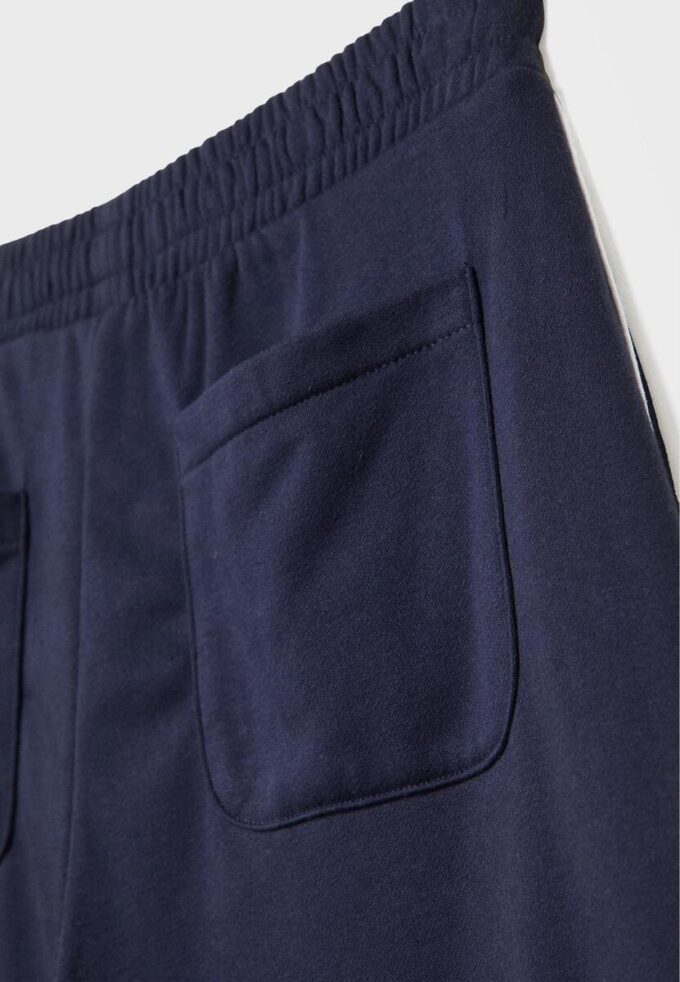 Pantaloni Wide Leg in tessuto felpato con bordino Pantaloni Wide Leg in tessuto felpato con bordino