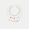 Set di 3 collane con ciondoli assortiti
