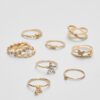 Set di 9 anelli a farfalla e strass