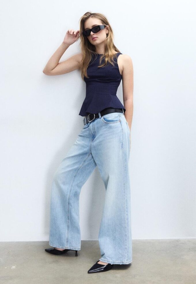 Top a peplo senza maniche a righe