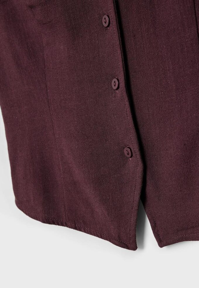 Top senza maniche abbottonato