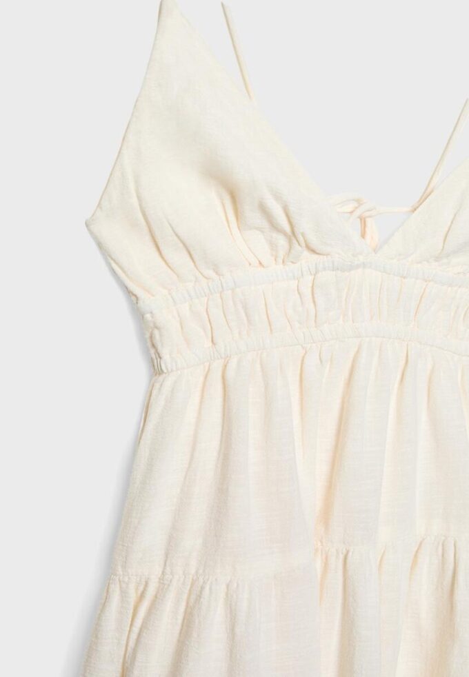 Vestito corto e fluido con dettaglio annodato sul retro